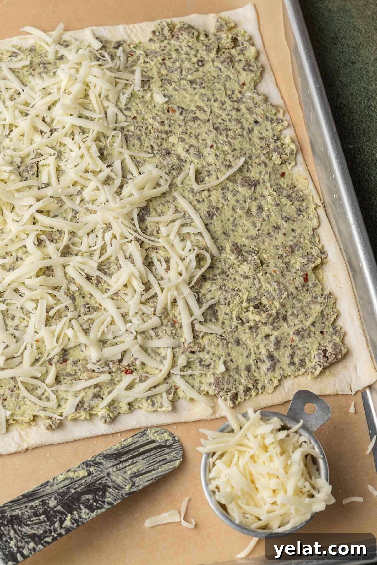 Savory Sausage Puff Pastry Twists Recipe for Parties 5 Puff pastry with sausage mixture and cheese on top