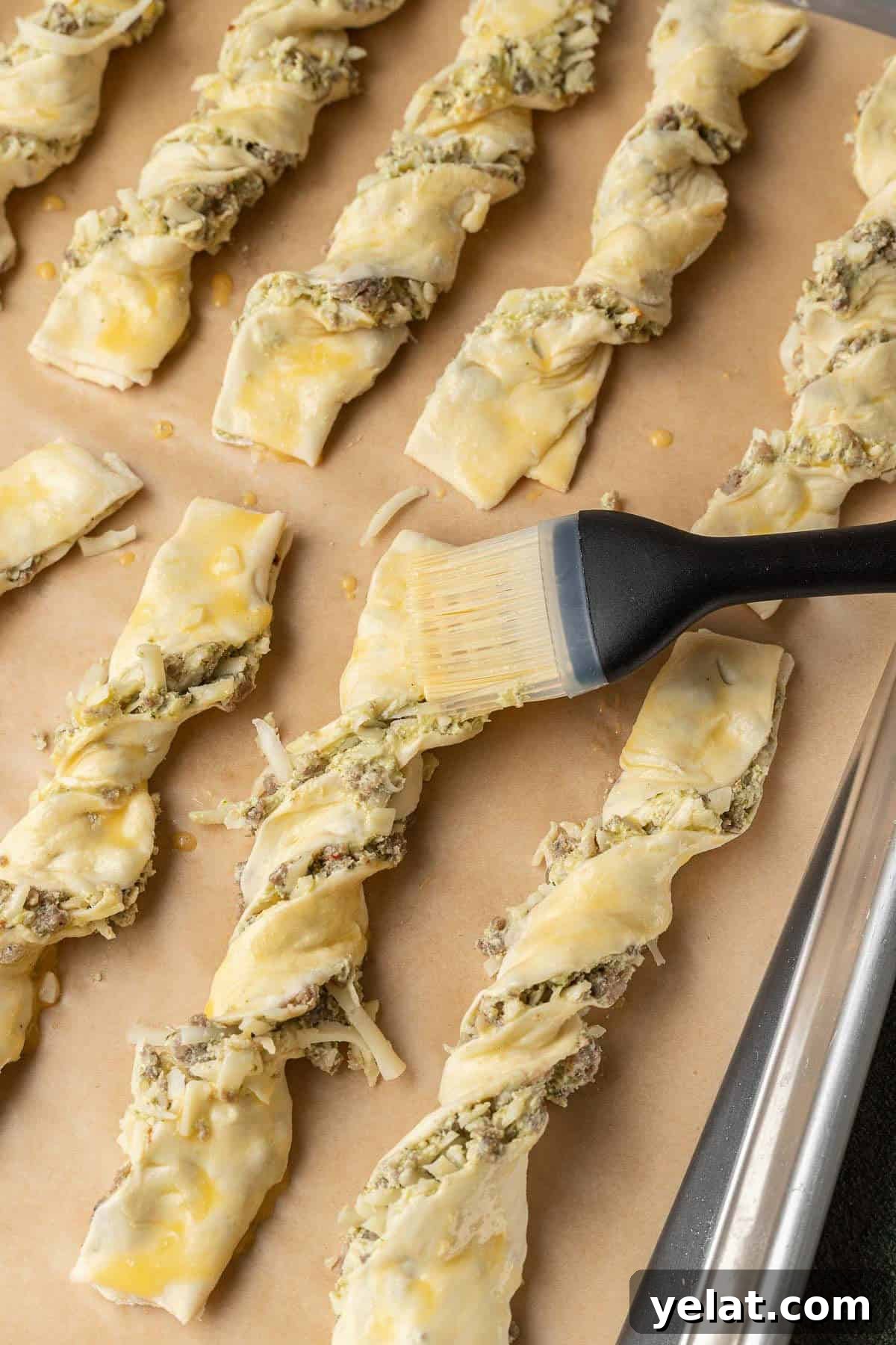 Savory Sausage Puff Pastry Twists Recipe for Parties 6 Brushing each pastry with egg wash