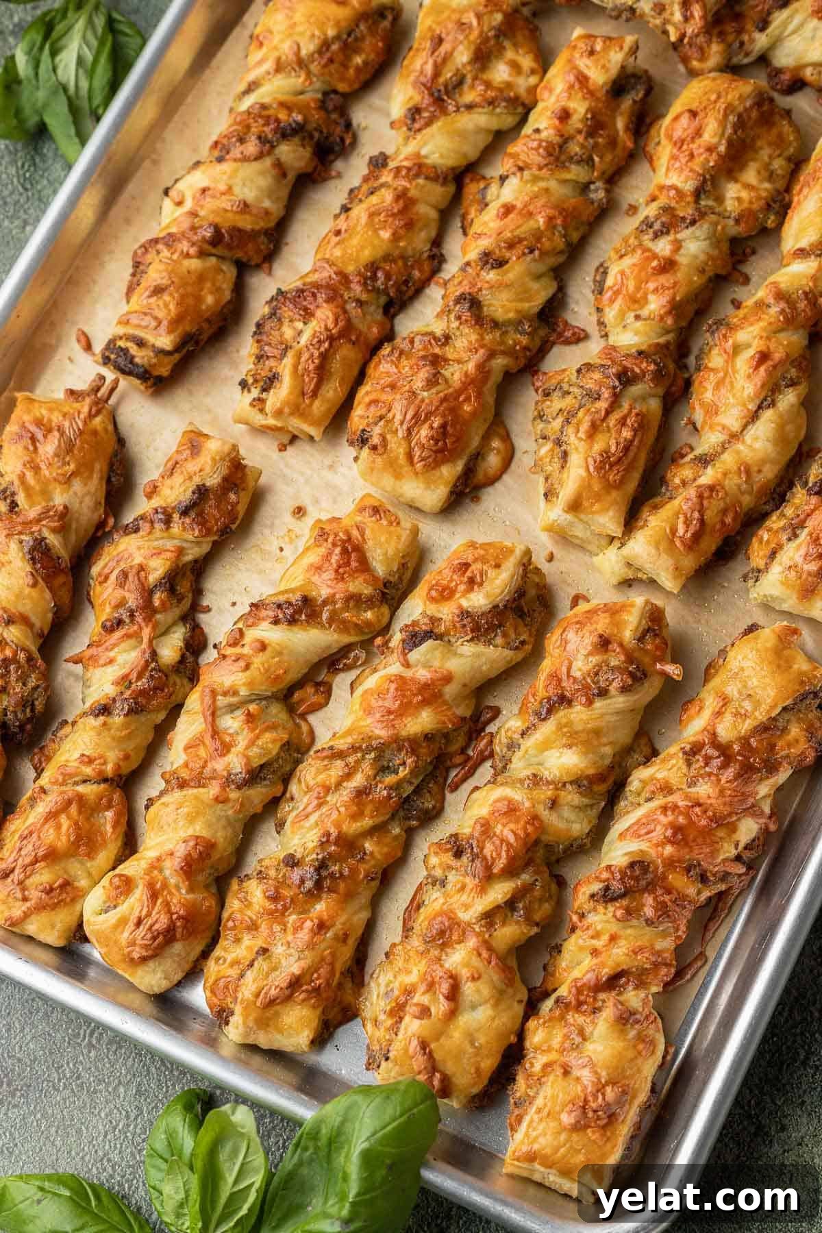 Savory Sausage Puff Pastry Twists Recipe for Parties 7 Sausage Pesto Twists on baking sheet