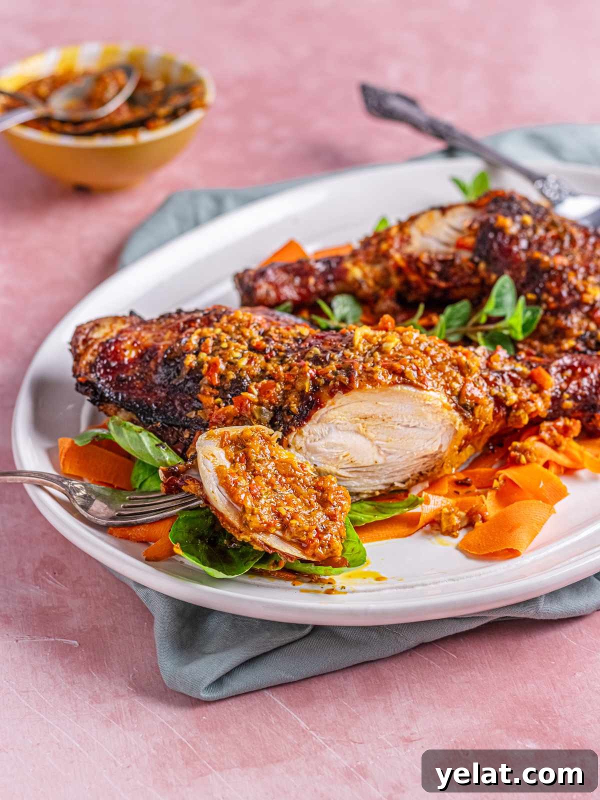 Peri-Peri Chicken Recipe: Spicy Portuguese Grilled Chicken Tutorial 2 A close up of peri peri chicken sliced and served with the sauce.