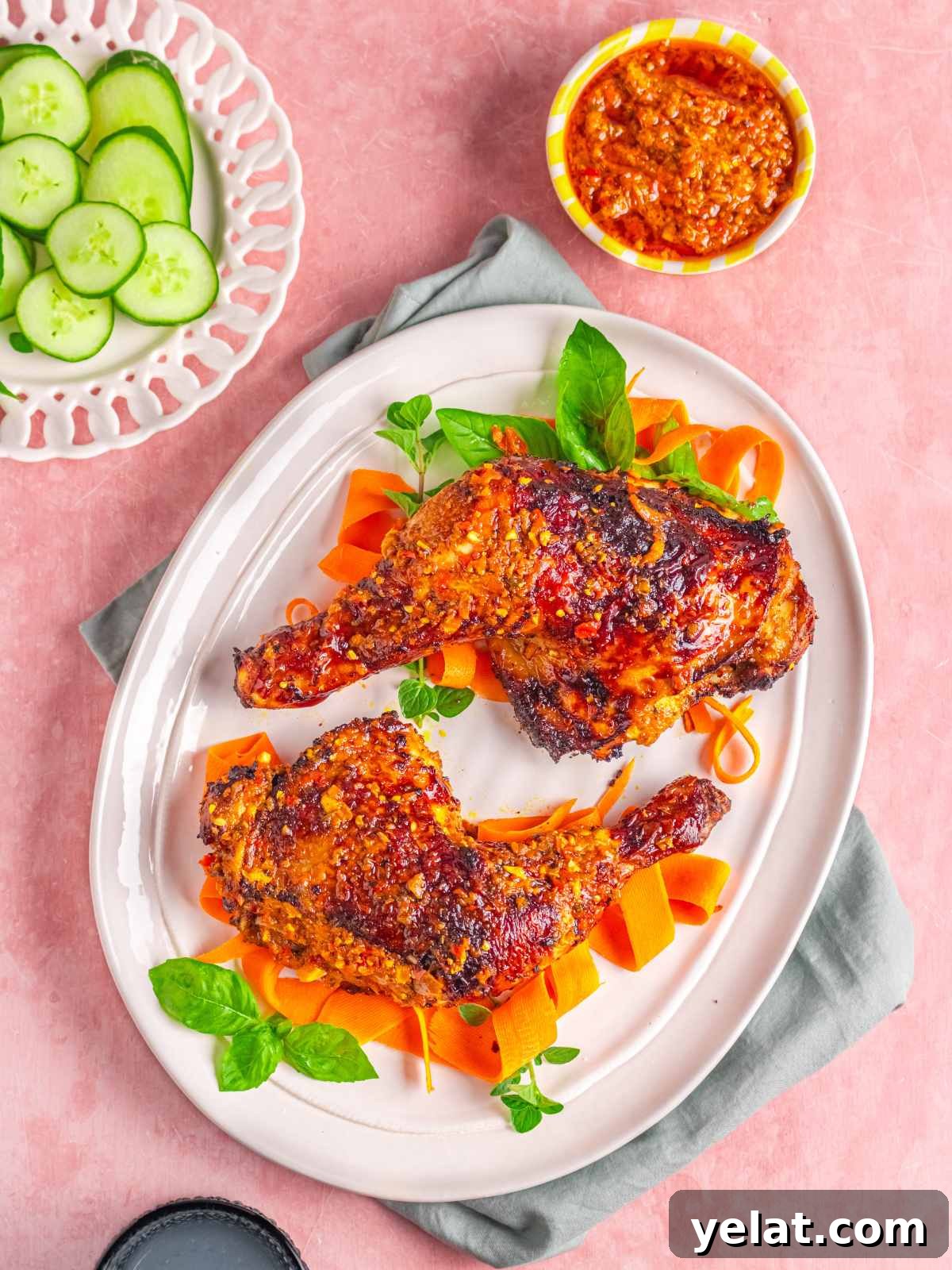 Peri-Peri Chicken Recipe: Spicy Portuguese Grilled Chicken Tutorial 9 peri peri chicken on a platter, served with carrots and cucumbers.
