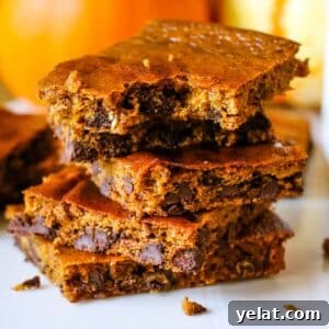 Gluten-Free Pumpkin Bars: Moist Fall Dessert Recipe 8 pumpkin bars stacked on top