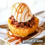stuffed apple half with ice cream and caramel drizzle.