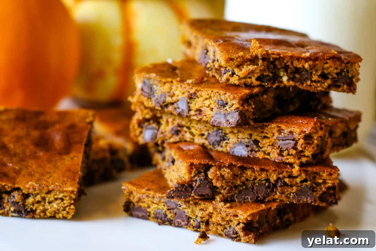 Gluten-Free Pumpkin Bars: Moist Fall Dessert Recipe 7 stacked pumpkin bars