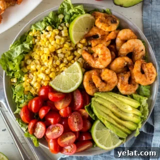 Grilled Shrimp, Avocado & Corn Salad with Lime Vinaigrette 5 top down shot of grilled shrimp and corn salad in a bowl