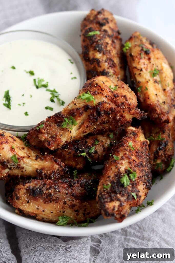 20 Delicious Things to Make in Your Air Fryer Tonight 5 crispy air fryer chicken wings in a bowl