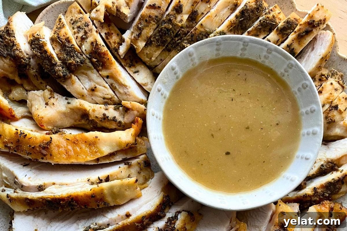 12 Crowd-Pleasing Easter Crockpot Recipes for a Stress-Free Holiday 3 Sliced herb-crusted turkey breast arranged on a plate next to a bowl of gravy.