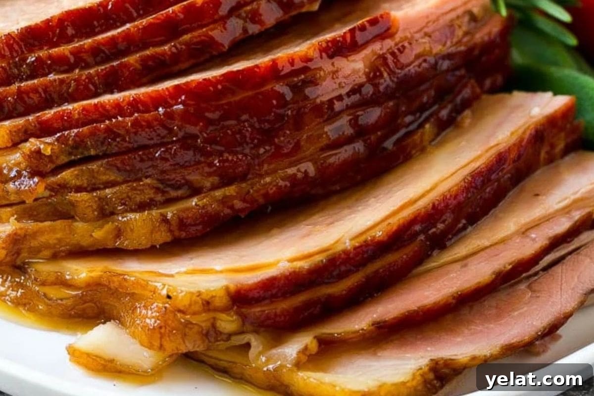 12 Crowd-Pleasing Easter Crockpot Recipes for a Stress-Free Holiday 9 Close-up of beautifully sliced glazed ham with caramelized edges, showcasing a golden brown sheen and tender texture.