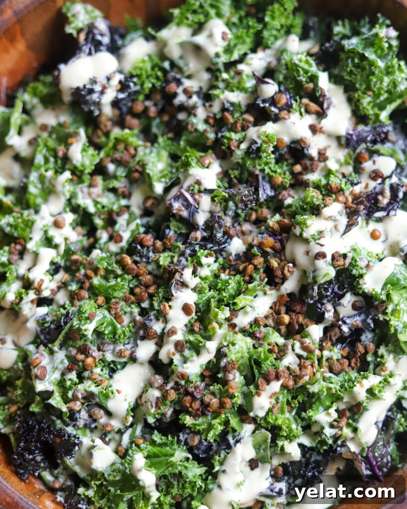 close up view of homemade vegan caesar power bowl with crispy lentils over kale.