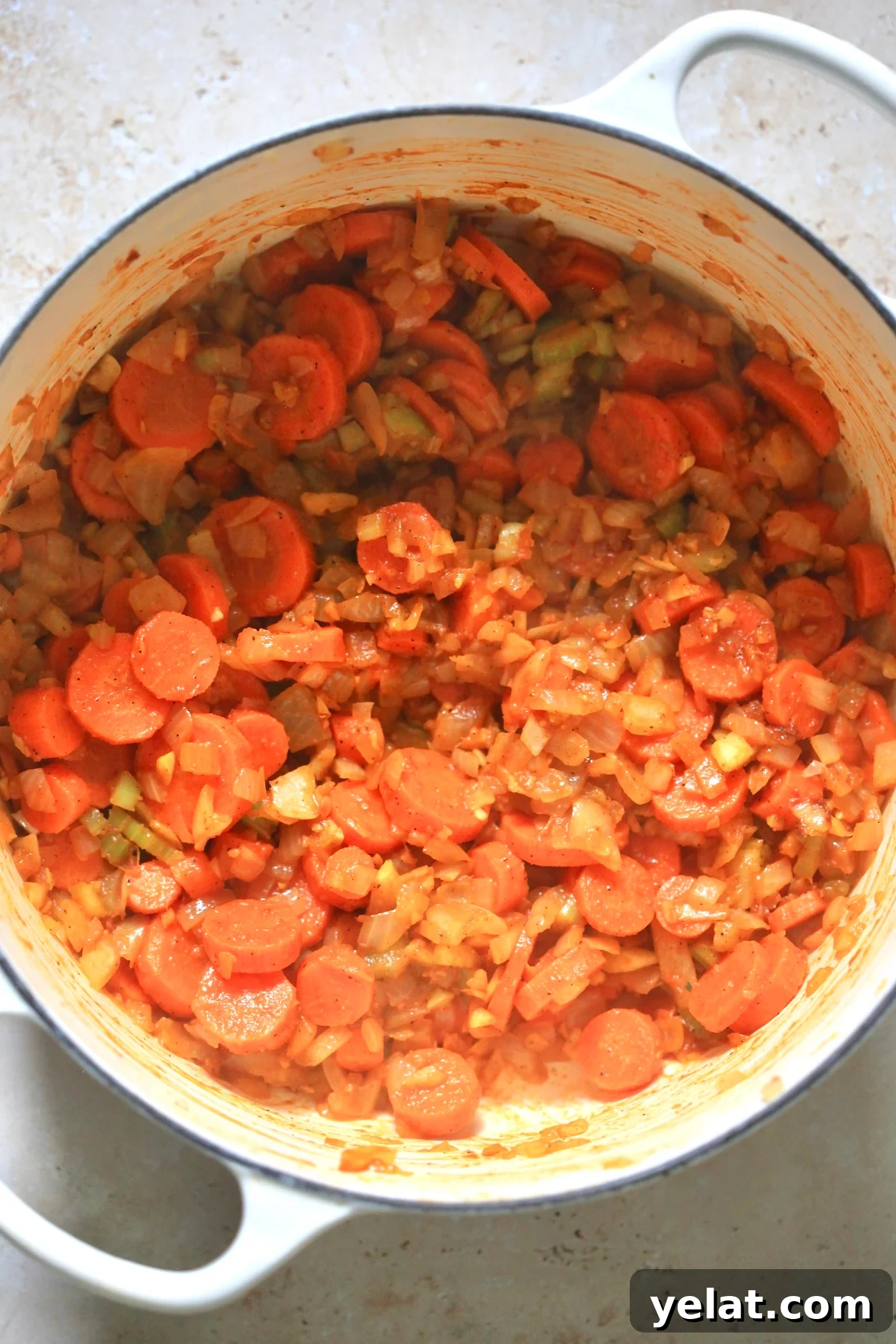 Hearty Carrot and Red Lentil Soup Recipe for Comfort and Flavor 4 carrots in pot with lentils.