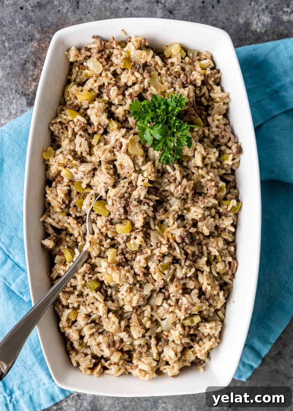 Authentic Cajun Dirty Rice Recipe: Flavorful One-Pot Meal 5 overhead image: dark brown rice side dish garnished with fresh parsley
