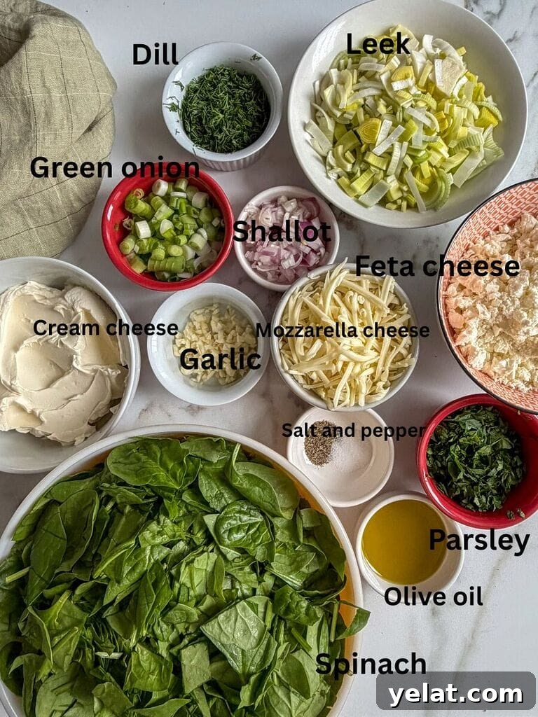 Ingredients which include: spinach, cream cheese, feta cheese, mozzarella cheese, green onions, dill, parsley, shallot, salt, pepper, olive oil, leek.
