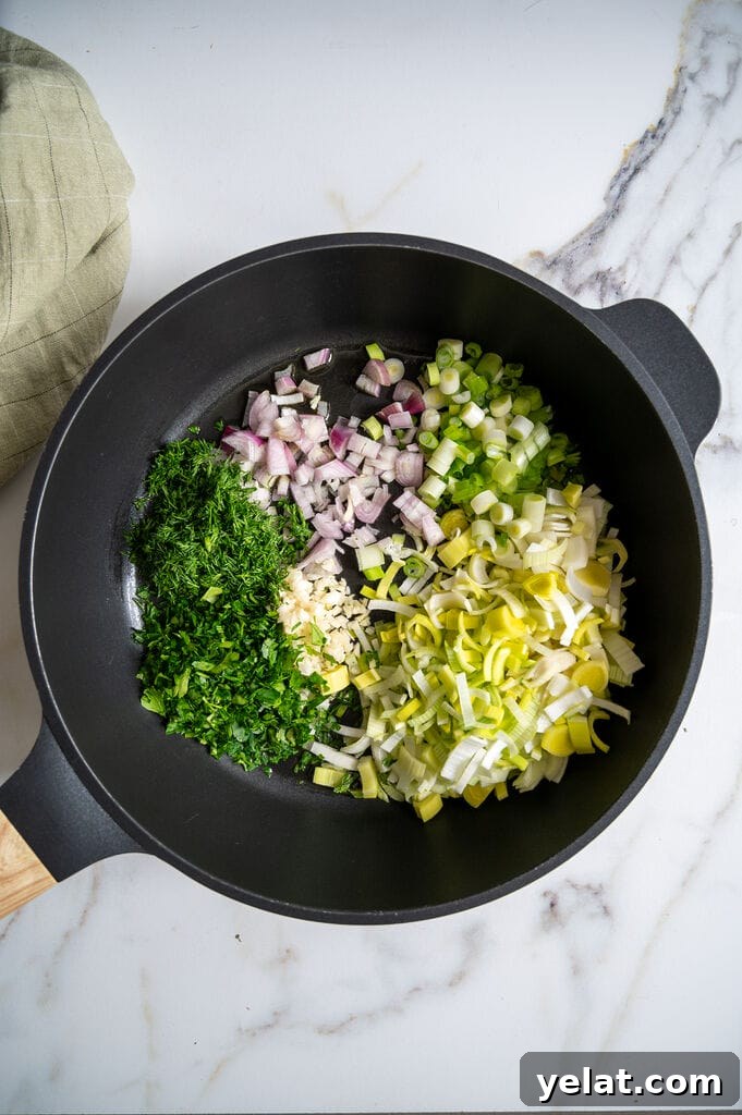 Ready to sauté the parsley, the dill, garlic, shallots, green onion and leek.