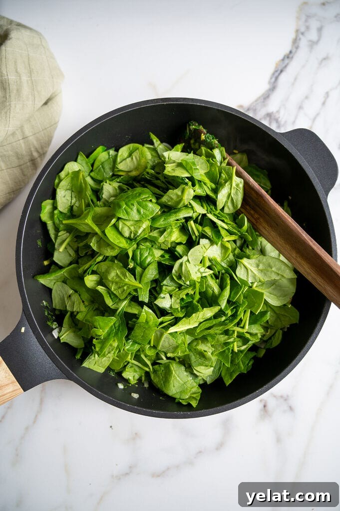 Adding the spinach.