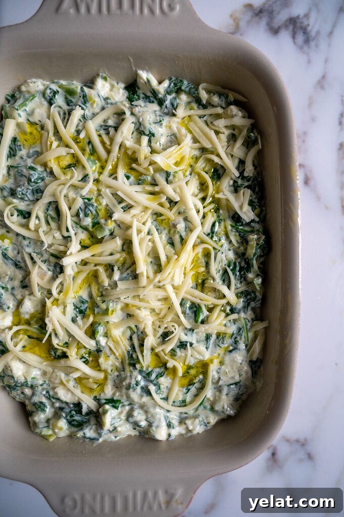 The spananakopita dip is assembled and ready to bake.