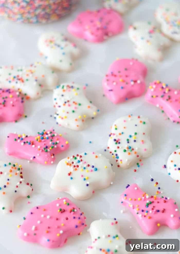 Homemade Circus Animal Cookies Recipe for Crunchy Iced Treats 15 pink and white circus animal cookies on parchment paper