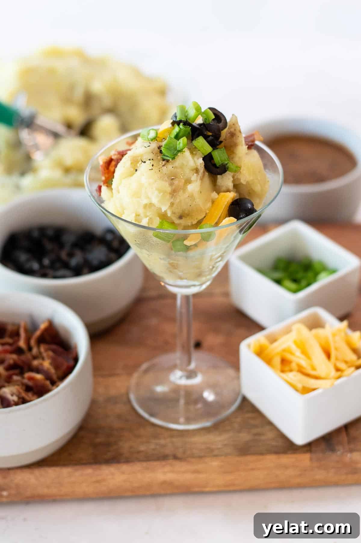Loaded Mashed Potato Bar Ideas with Toppings and Mashtini Recipes 2 mashed potatoes in a martini glass with toppings