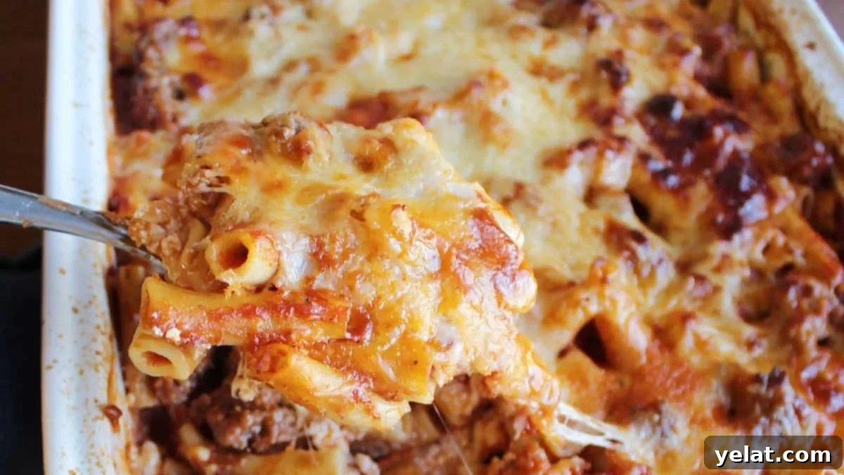 No boil baked ziti scooped up on a serving spoon.