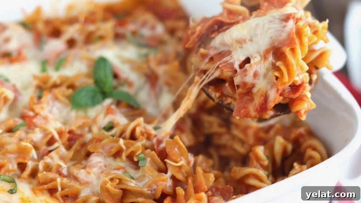 Pizza pasta bake in a white dish.