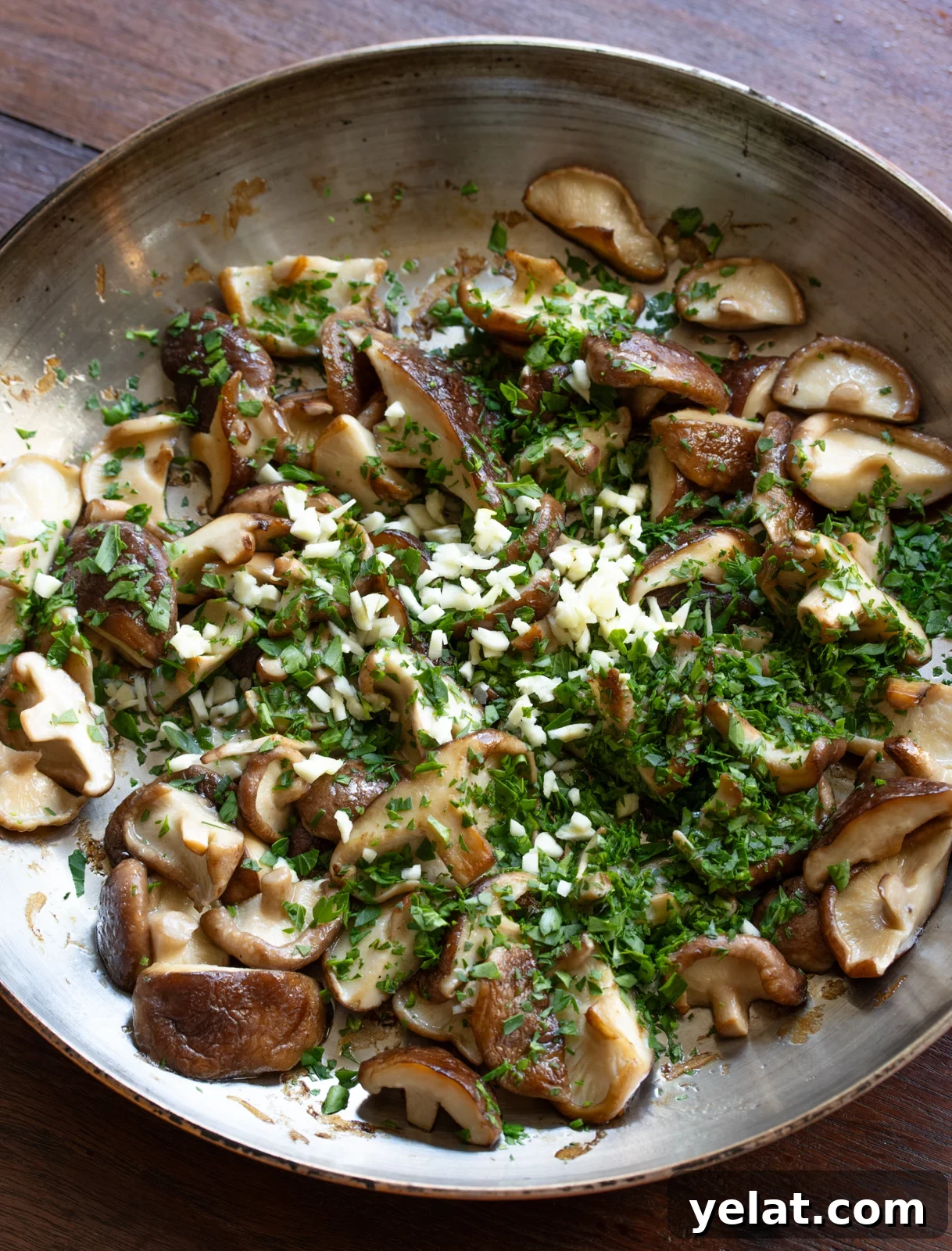 garlic and parsley added to the mushrooms
