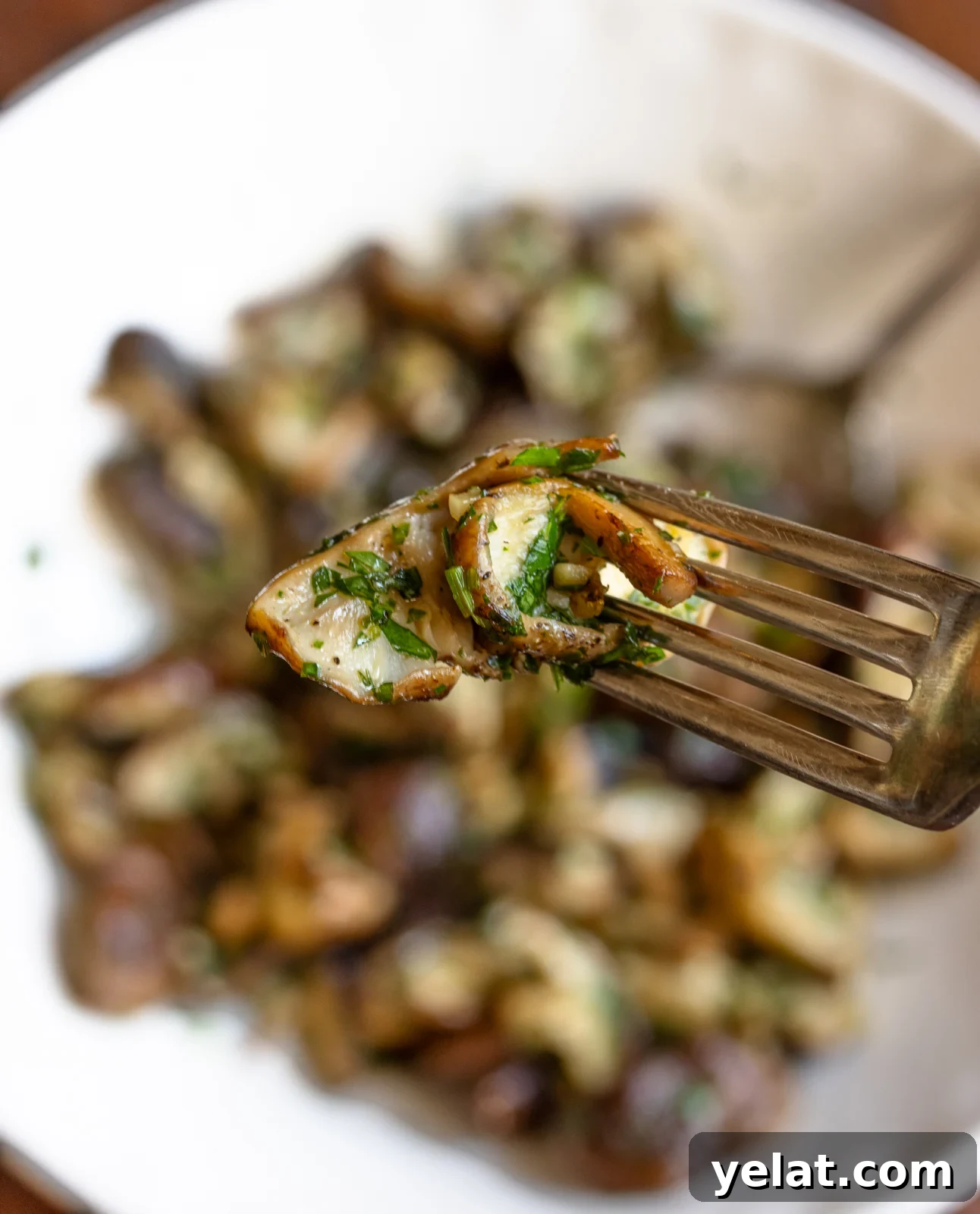garlic mushrooms on a spoon