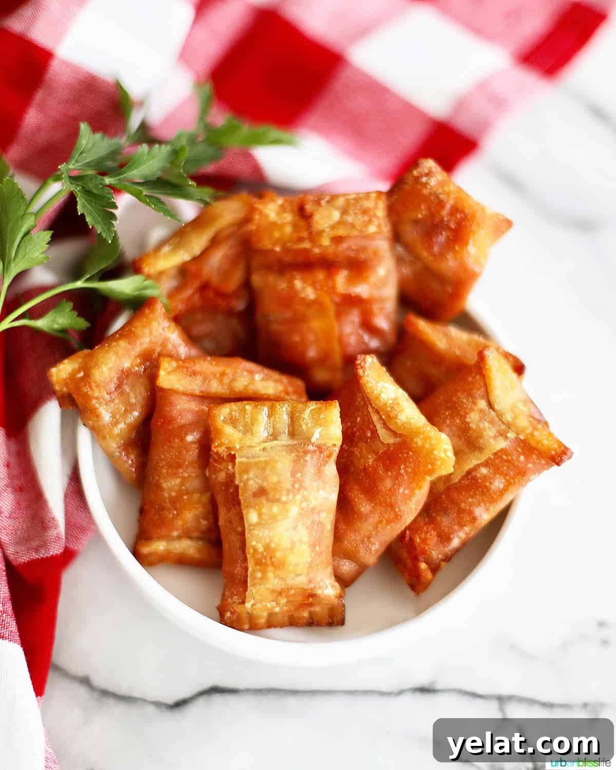 air fryer pizza rolls in a white bowl over a checkered tablecloth