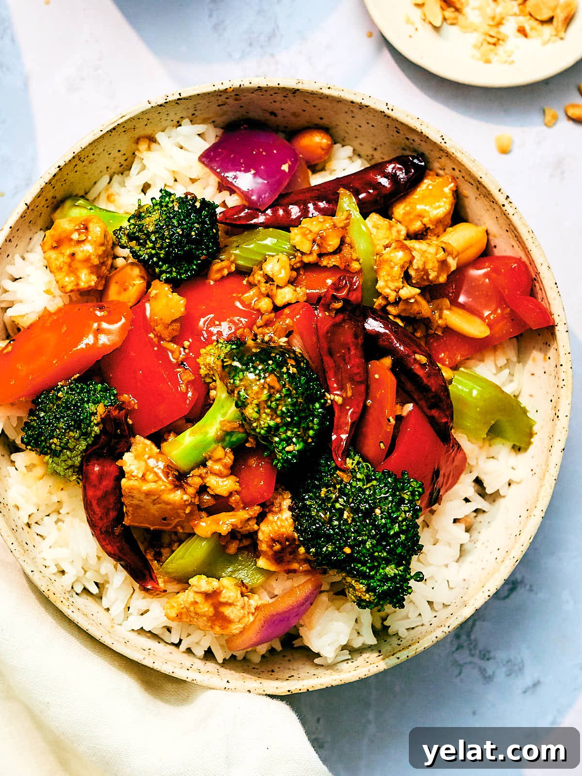 Spicy Kung Pao Tofu with Stir-Fried Vegetables 2 A bowl of Kung Pao Vegetables with Tofu and rice.