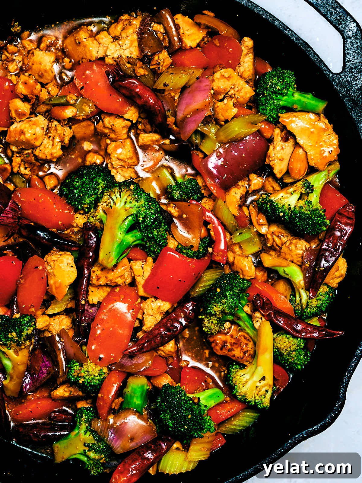 Spicy Kung Pao Tofu with Stir-Fried Vegetables 14 Saucy Kung Pao Vegetables with Tofu in a cast iron skillet.