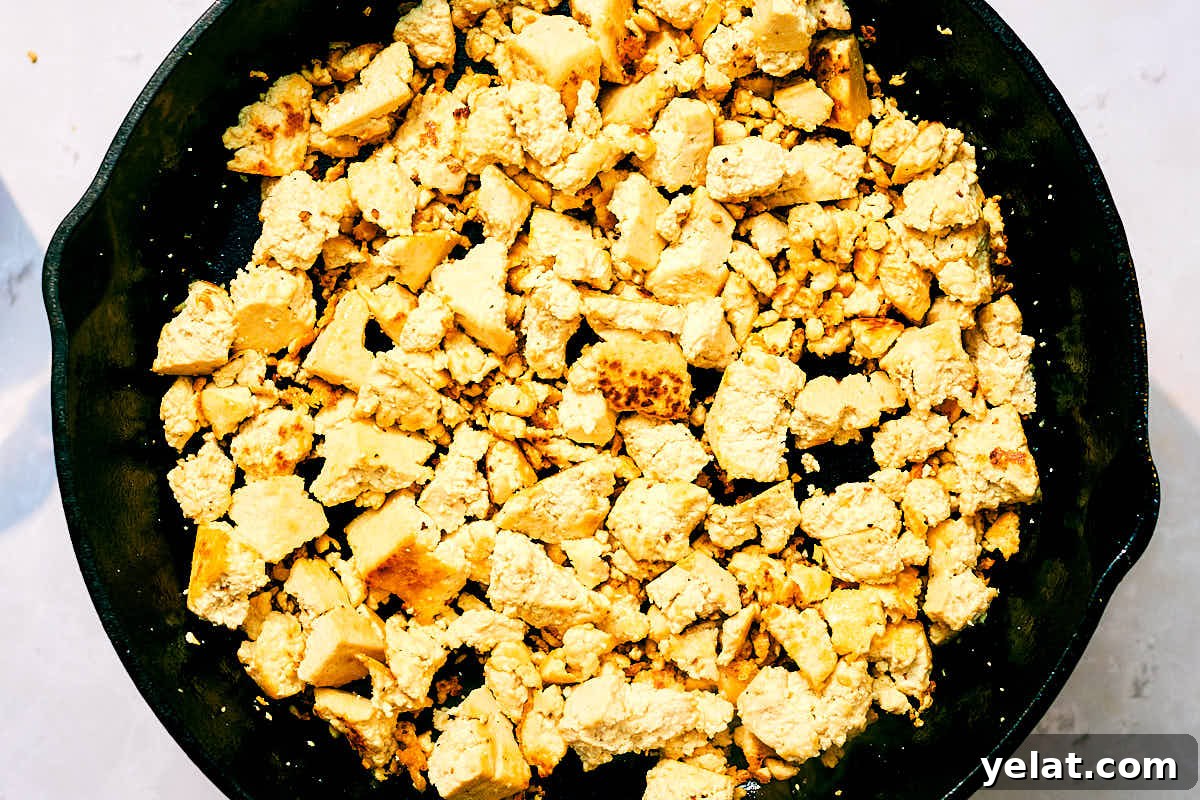 Spicy Kung Pao Tofu with Stir-Fried Vegetables 9 Crumbled tofu sauteed until golden brown in a skillet.