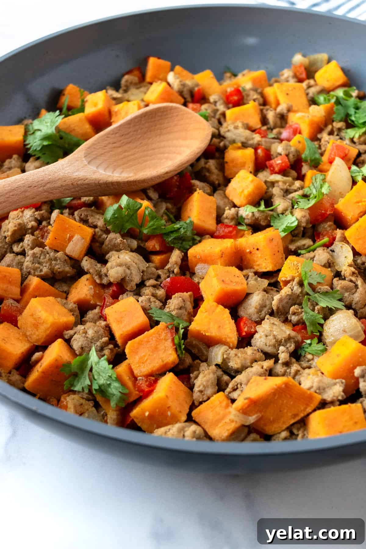 Sweet Potato and Turkey Hash with Spinach & Herbs 2 Closeup of Turkey Hash with Sweet Potatoes in a Skillet.