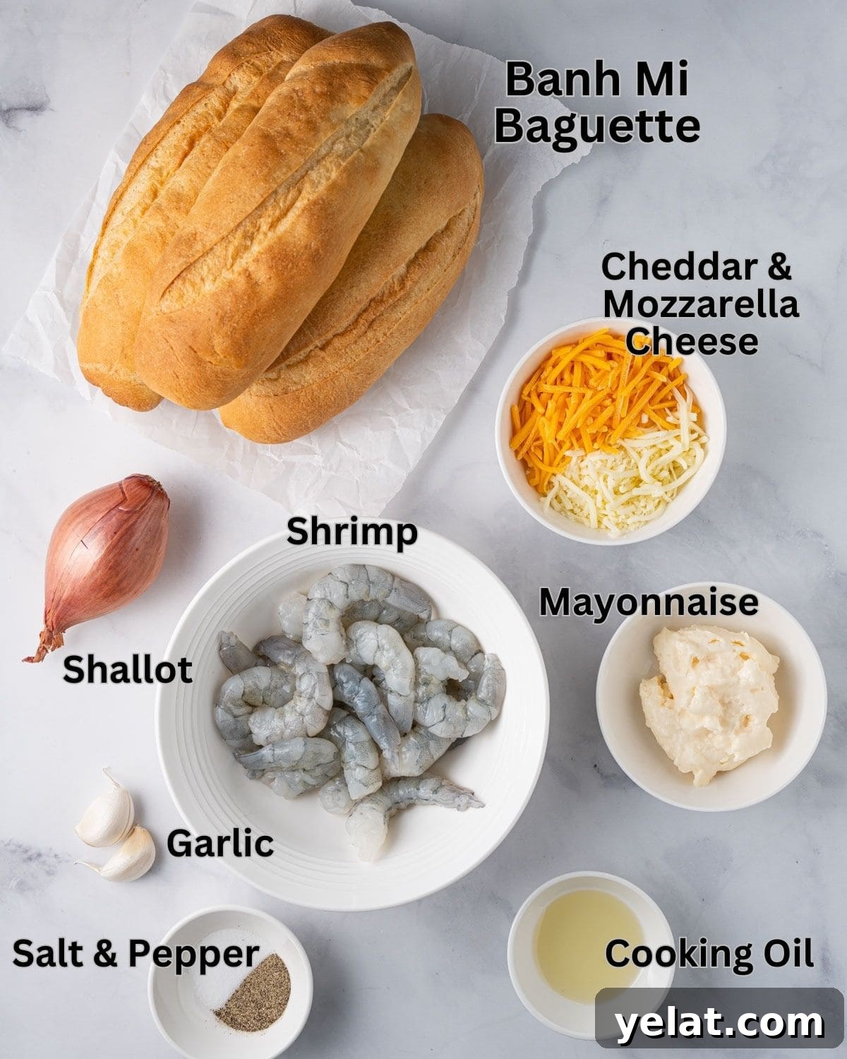 Ingredients needed for Vietnamese Shrimp Toast: banh mi baguette, shrimp, cooking oil, shallot, garlic, mayonnaise, cheddar, mozzarella, salt and ground pepper.