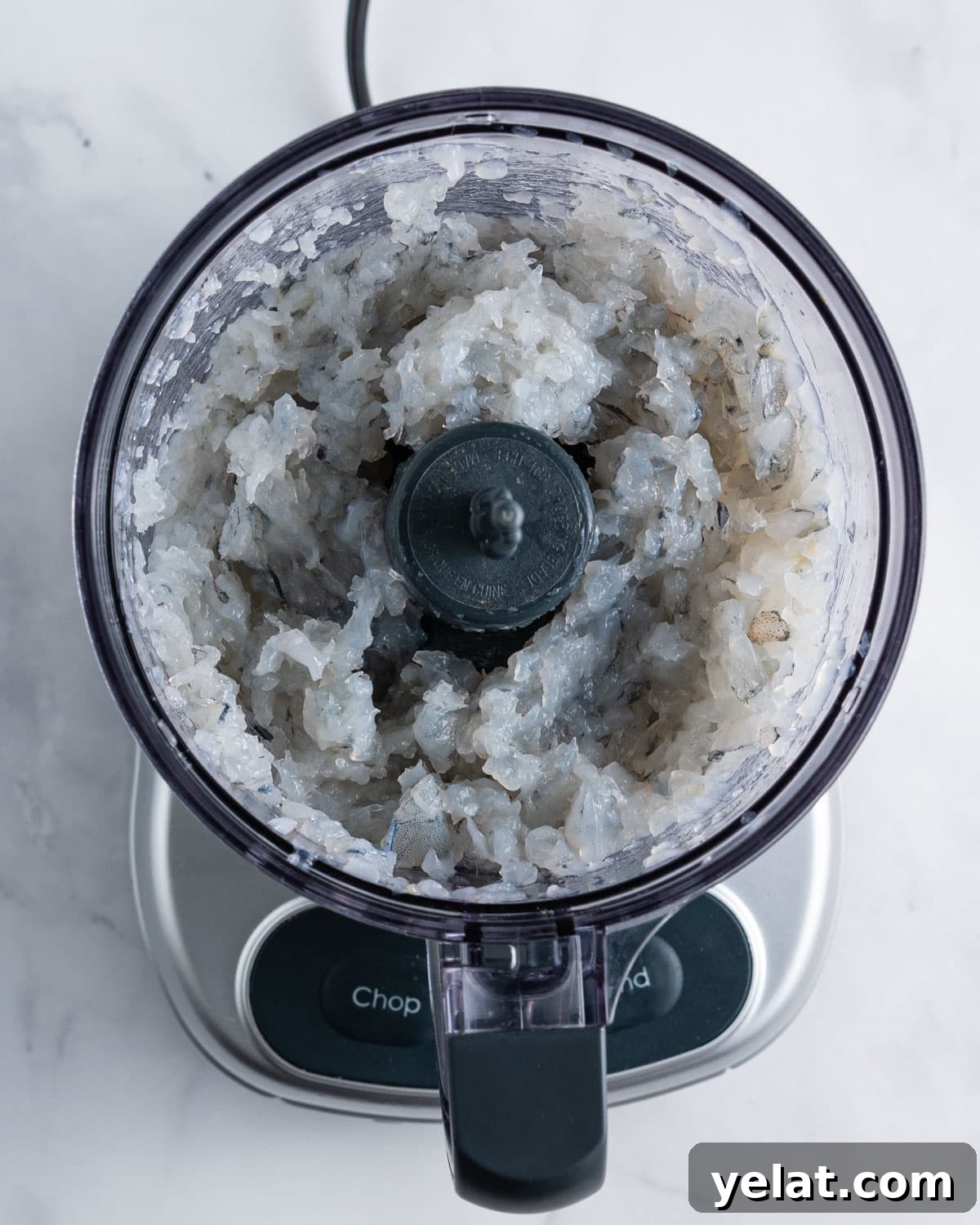Chopped shrimp in a food processor.