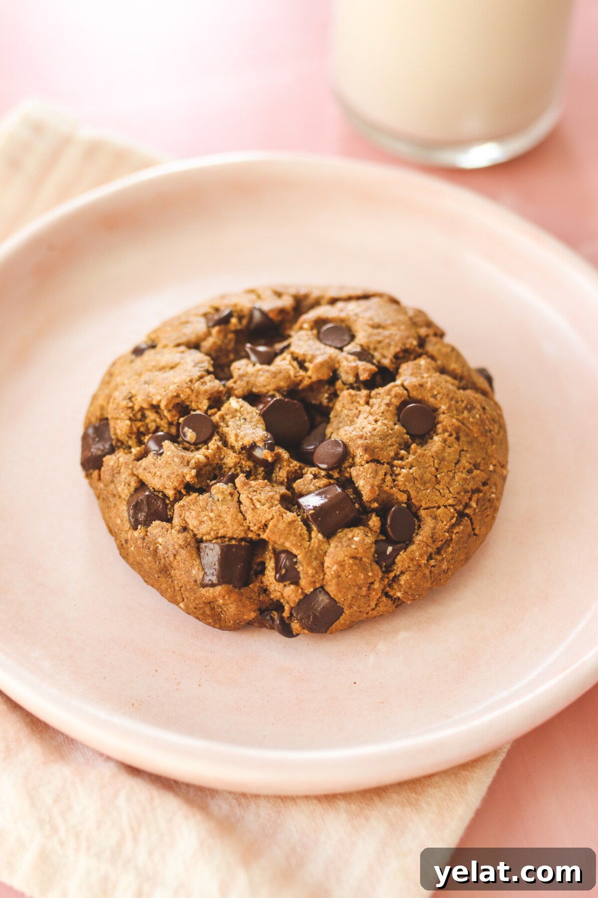 a close up photo of this copycat Levain cookie recipe on a pink plate