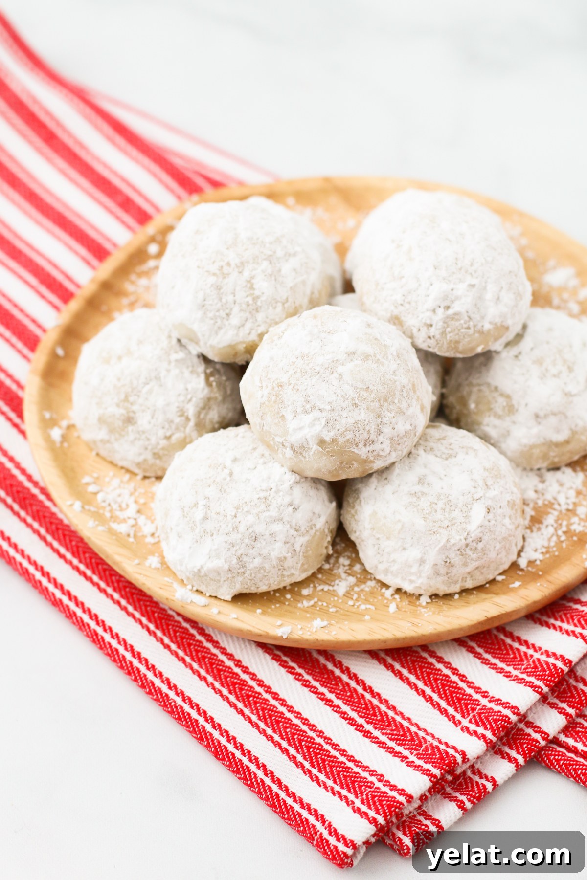 Gluten Free Vegan Snowball Cookies. Also known as Russian tea cakes, these powdered sugar coated cookies are made with flavorful toasted walnuts. A buttery, simple holiday cookie!