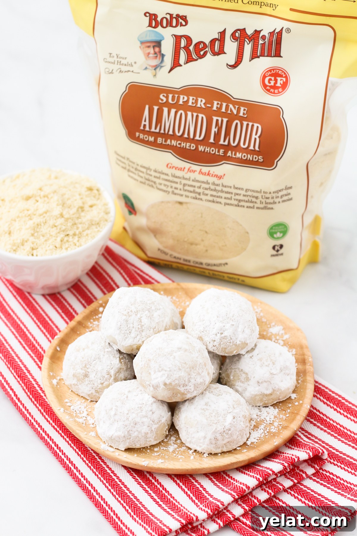 Gluten Free Vegan Snowball Cookies. These buttery, simple cookies are made with Bob’s Red Mill almond flour and toasted walnuts. Festive and flavorful!