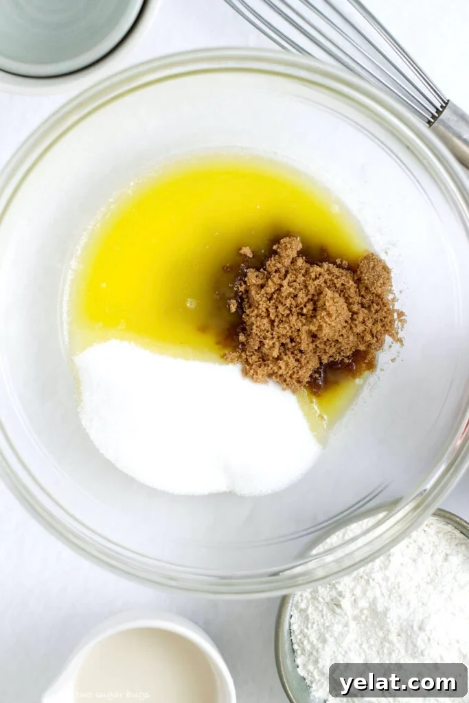 Decadent Brownie Batter Ice Cream Recipe with Fudgy Chunks 6 melted butter, brown sugar and granulated sugar in a mixing bowl