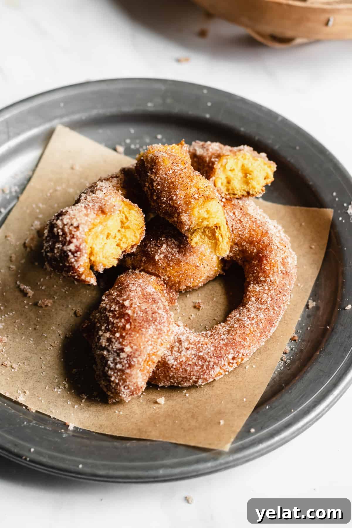 One ripped apart Pumpkin Spice Soft Pretzel on a plate