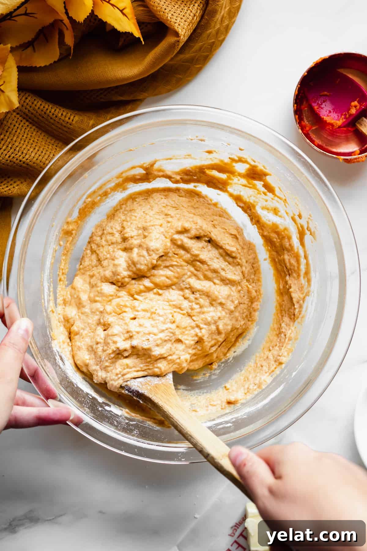 Pretzel dough being mixed in a bowl.