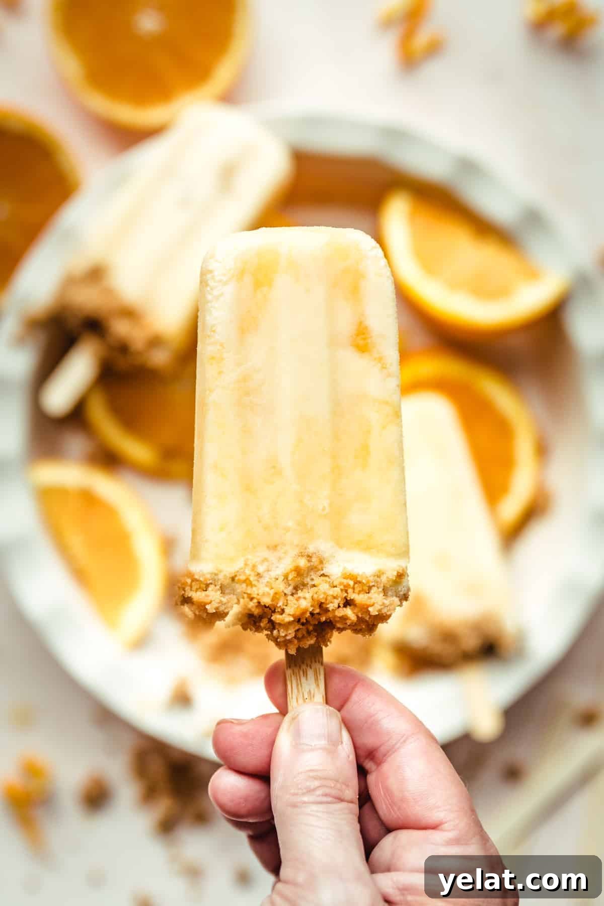 Creamsicle Ice Pops with Graham Cracker Crumble 11 You won't believe how easy it is to make your own orange creamsicles at home!