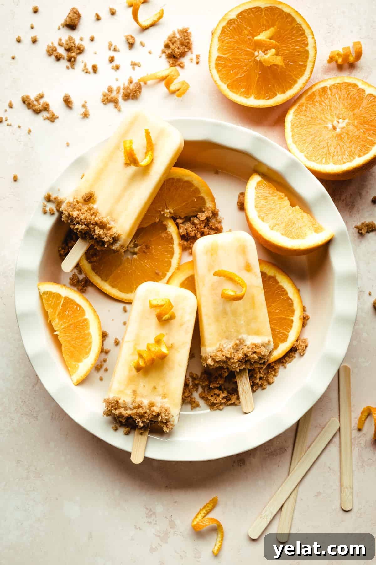 Creamsicle Ice Pops with Graham Cracker Crumble 9 These orange creamsicles are the perfect sweet treat for the entire family!