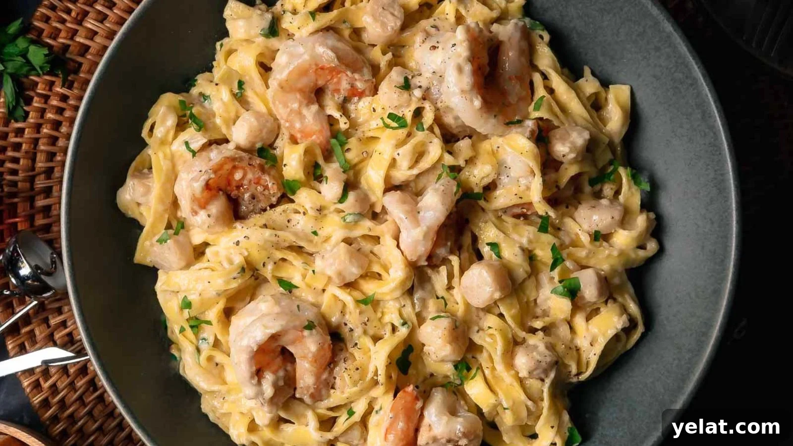 Homemade Seafood Alfredo with Real Alfredo Sauce: Pasta served with shrimp and scallops in a rich Alfredo sauce.