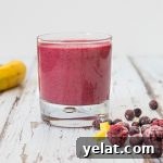 red berry smoothie in a glass