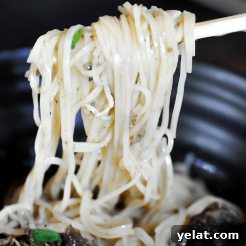 Noodles in black bowl