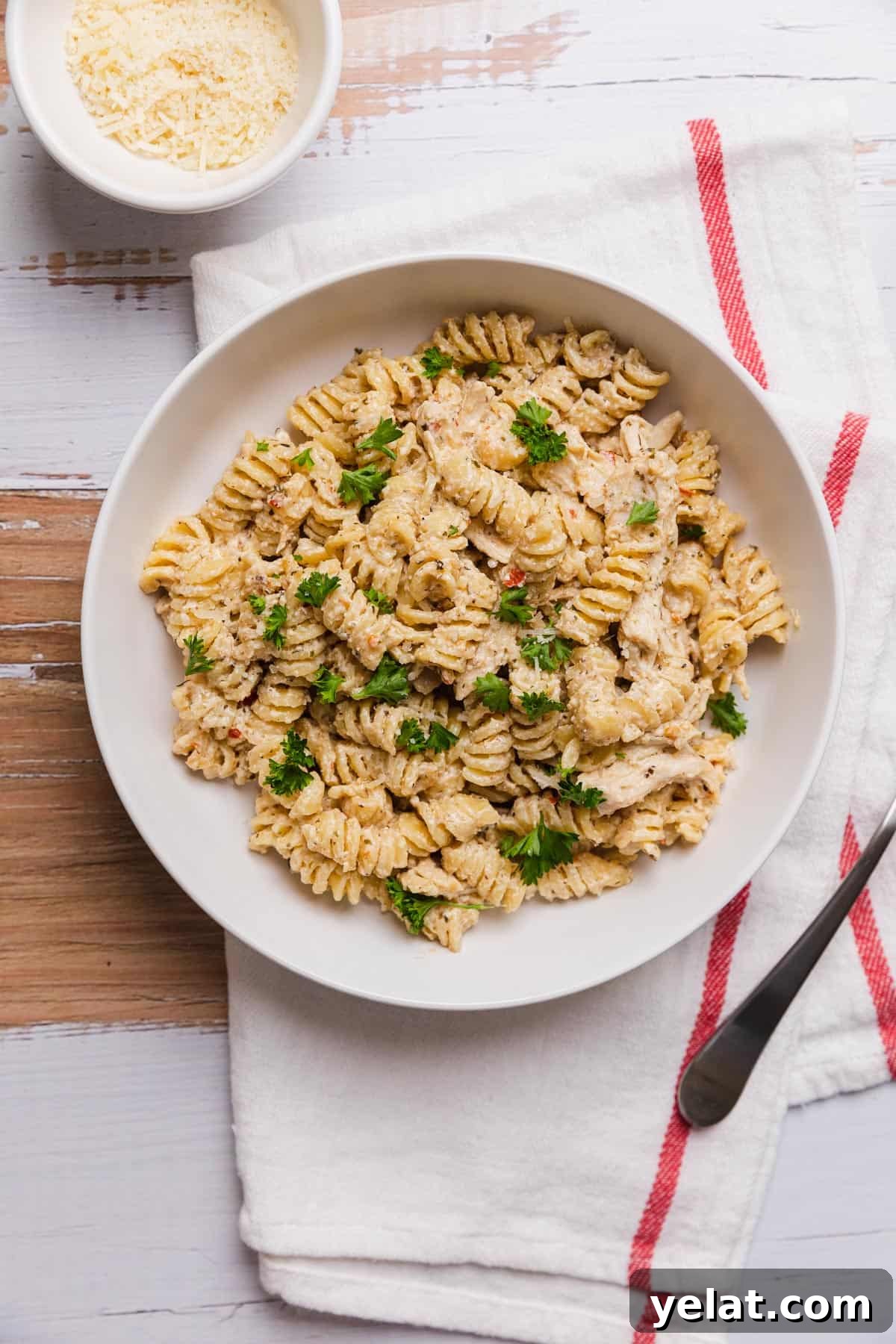 Slow-Cooker Garlic Parmesan Chicken Pasta Recipe 2 a bowl of a creamy rotini pasta dish