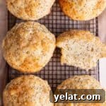25 Sourdough Breakfast Ideas: 25+ Recipes for Morning Bread Dishes 13 Lemon muffins with coarse sugar sitting on a cooling rack
