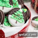 Festive Christmas Oreo Cookie Recipes for Holiday Baking 10 A tin of christmas oreo cookies with a christmas tree on it.