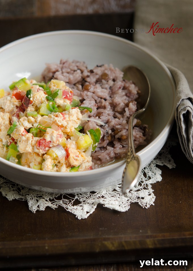 Tomato, Egg & Tofu Stir-Fry: Quick Savory Weeknight Recipe 9 Delicious soft tofu and tomato eggs are served with mixed grain rice.