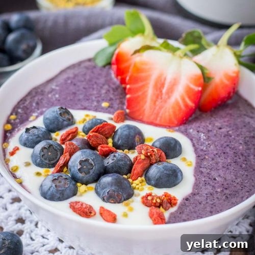 Blueberry Acai Smoothie Bowl topped with fresh berries and superfoods