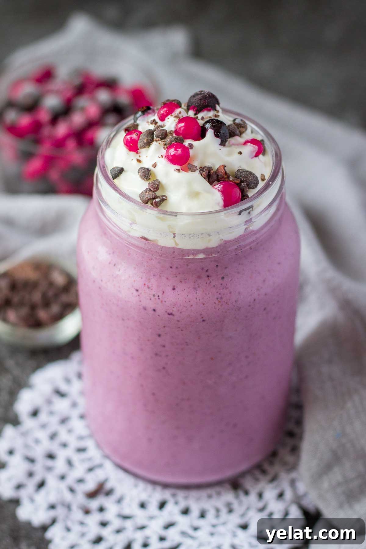 Creamy Mixed Berry Smoothie Recipe for Energy and Taste 4 Mixed Berry Smoothie topped with cream served in a glass with a straw