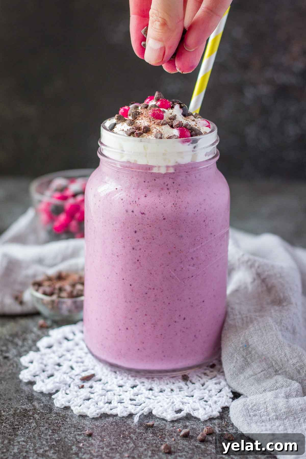 Creamy Mixed Berry Smoothie Recipe for Energy and Taste 5 Berry Smoothie topped with cream served in a glass with a straw